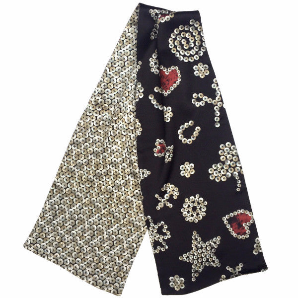 Pure silk satin scarf in a reversible design of pearly prints. Inspired by pearly kings and queens of London. Muffler length.