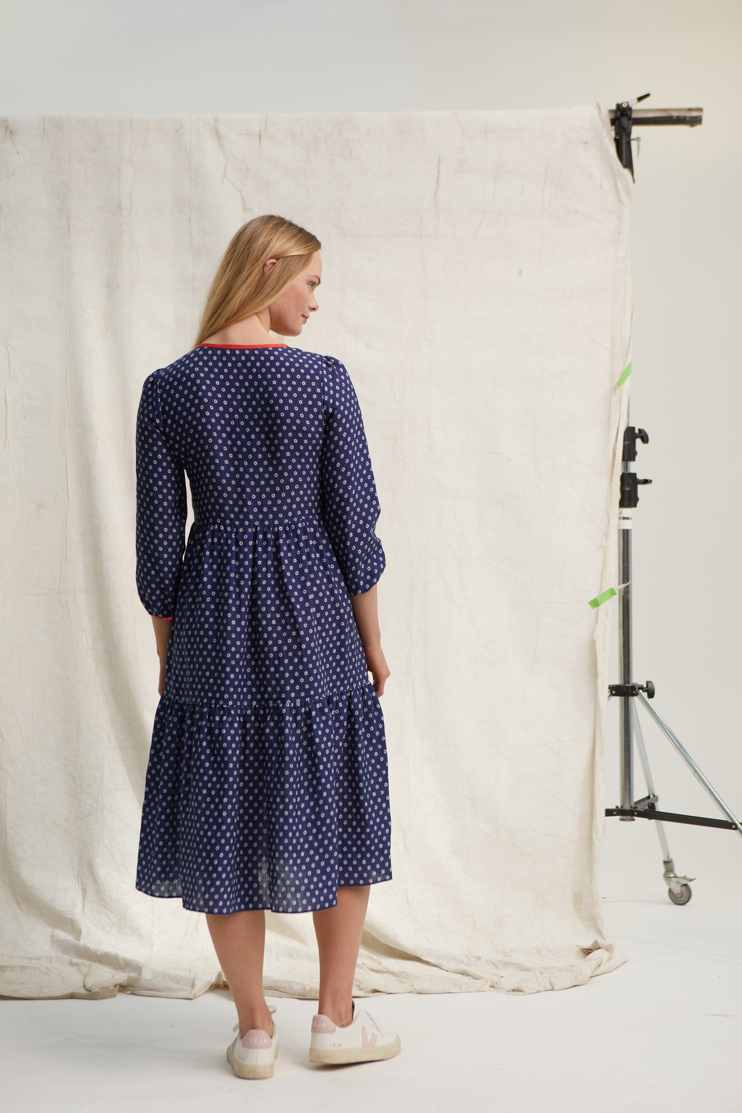 Navy three tier linen dress. Star print. Easy fit. Over the head. Scoop neckline. Side slip pockets. Long sleeve. Low mid calf length. 100% linen