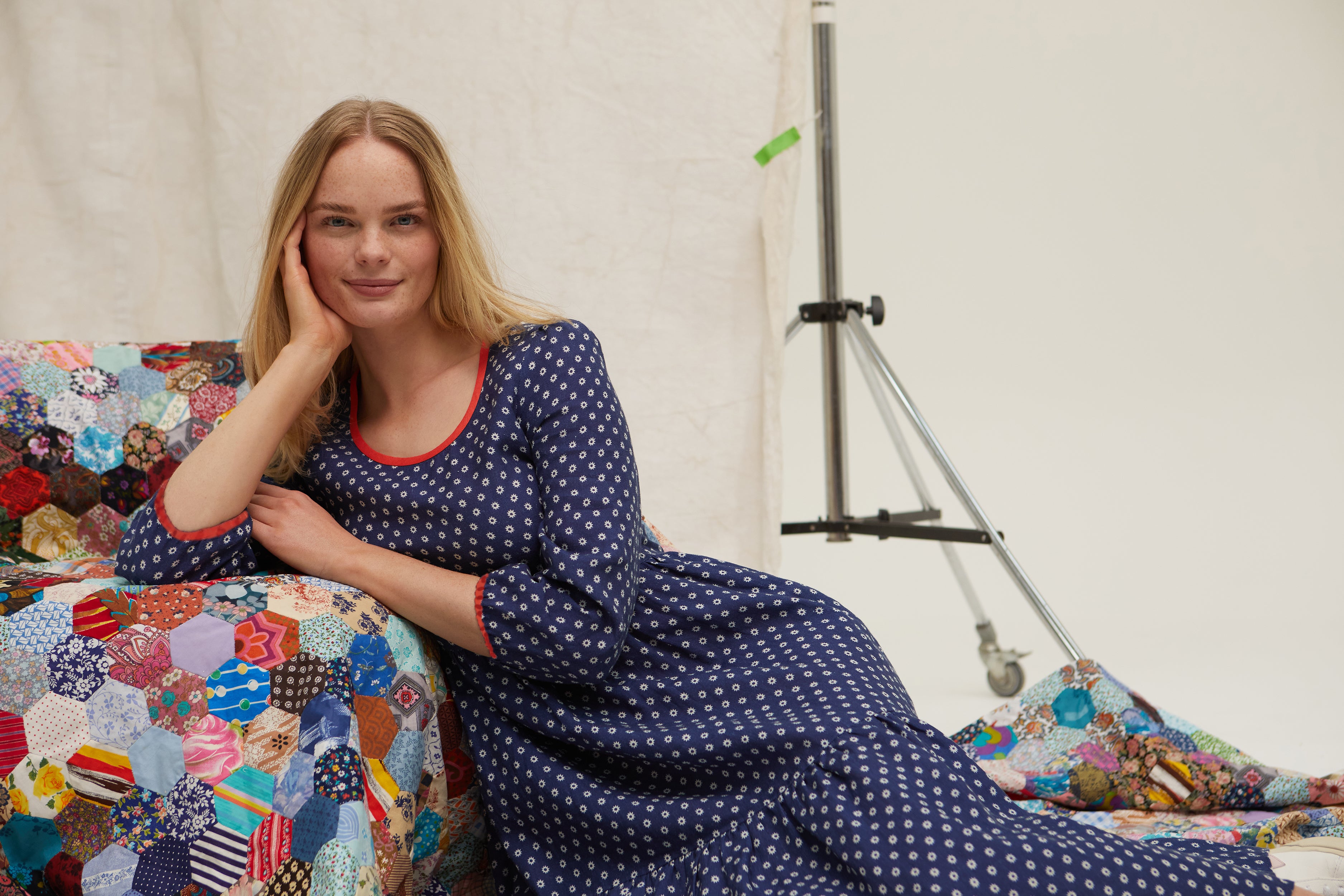 Navy three tier linen dress. Star print. Easy fit. Over the head. Scoop neckline. Side slip pockets. Long sleeve. Low mid calf length. 100% linen