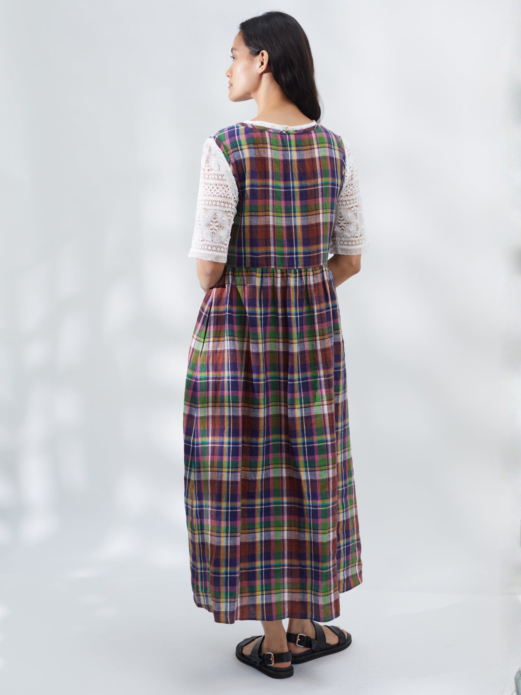 Woman wearing a plaid dress on a white background | Made in England | Justine Tabak 