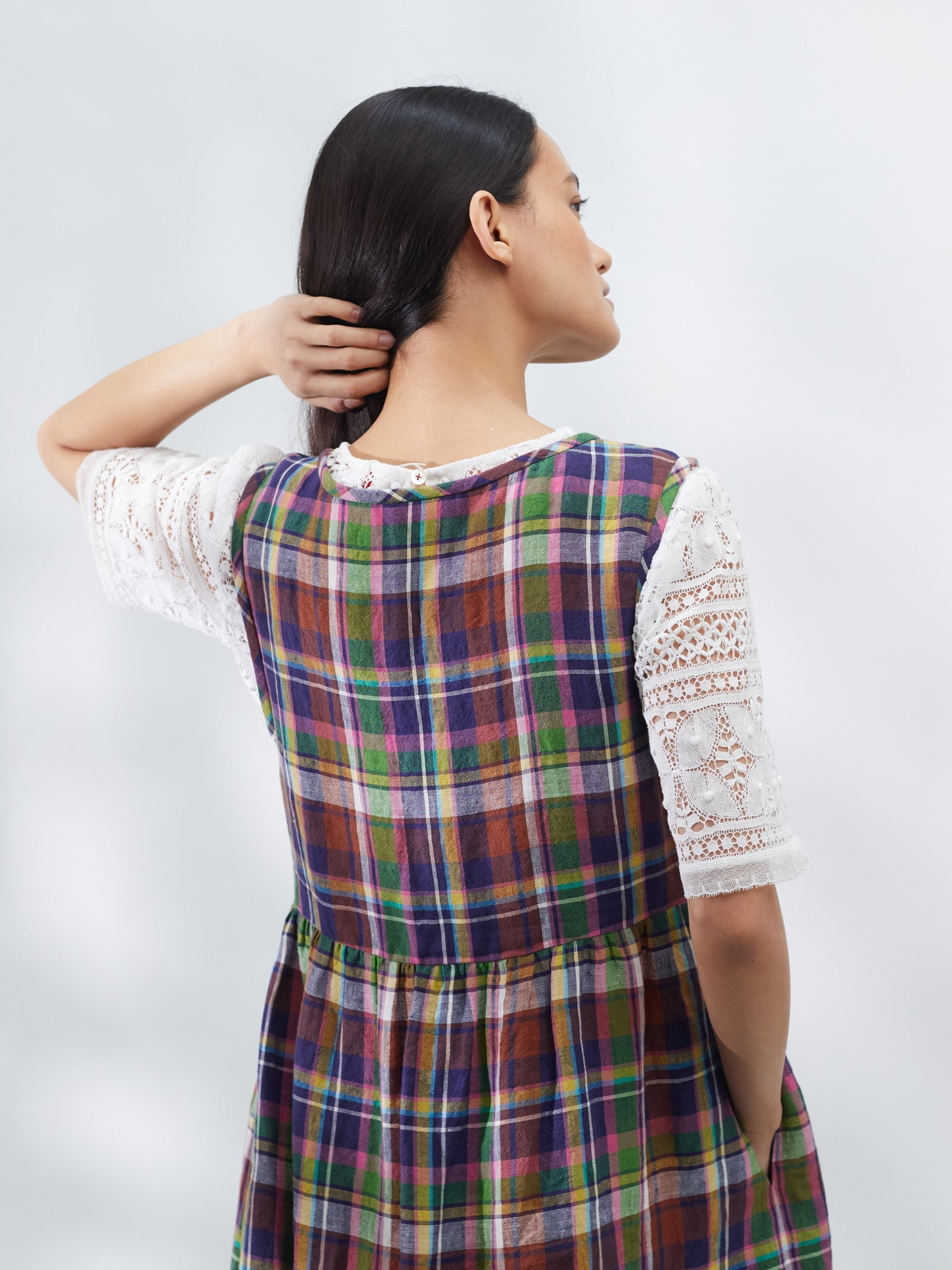 Woman wearing a plaid dress on a white background | Made in England | Justine Tabak 
