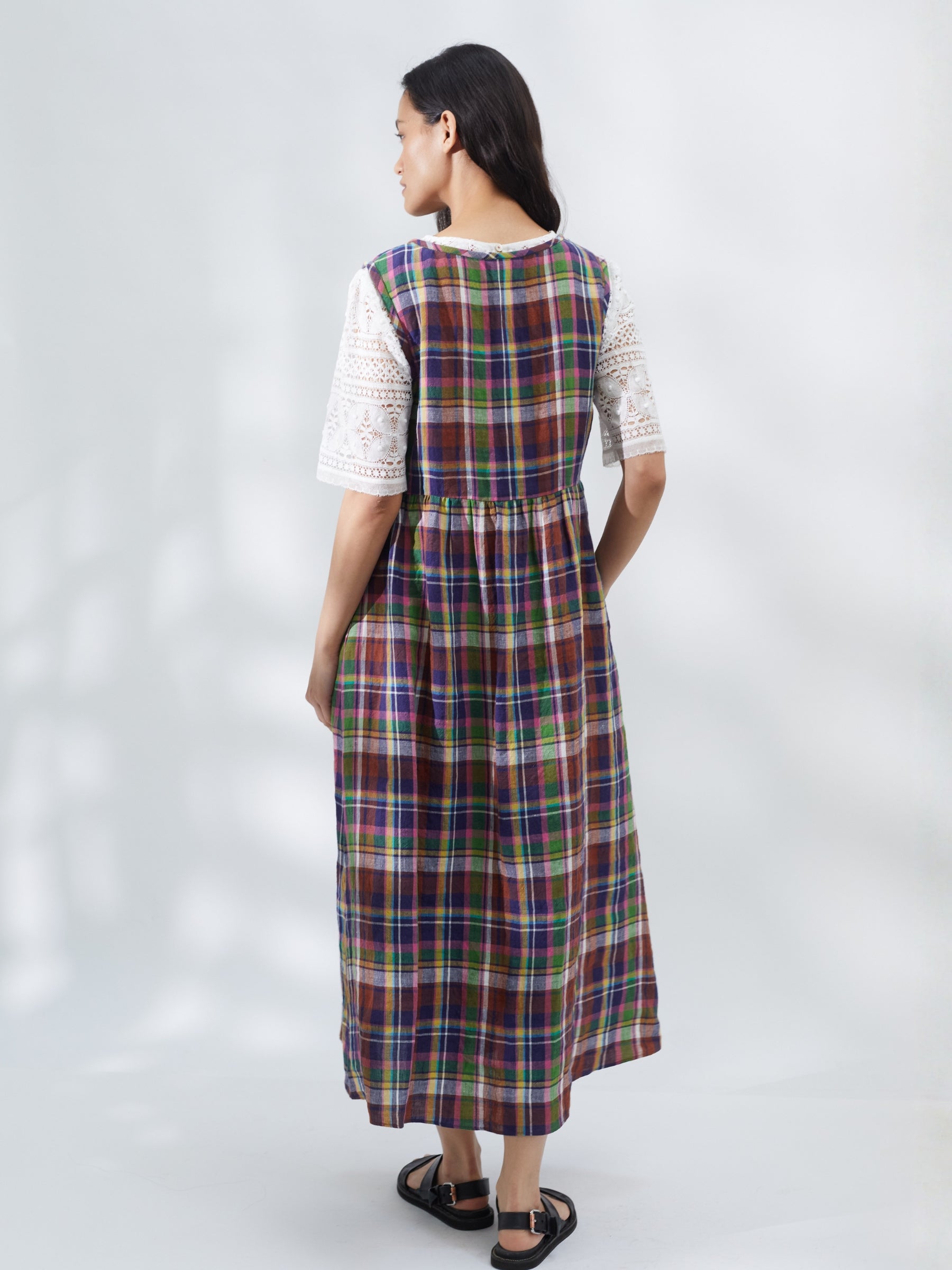 Woman wearing a plaid dress on a white background | Made in England | Justine Tabak 