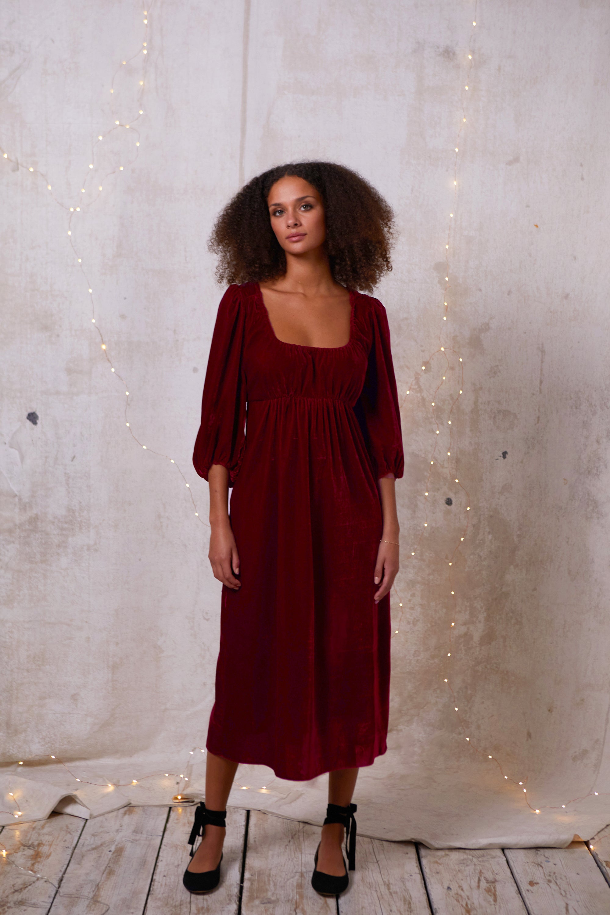 Made out of a deadstock, sustainable velvet, this dress is a 'modern romantic'. Easy and comfortable for glamorous day or party. Softly elasticated neckline, gentle gathering at the bust that sits above an empire seam giving the soft illusion of Regency dresses.  Billowing sleeves gathered into a soft elastic cuff. 