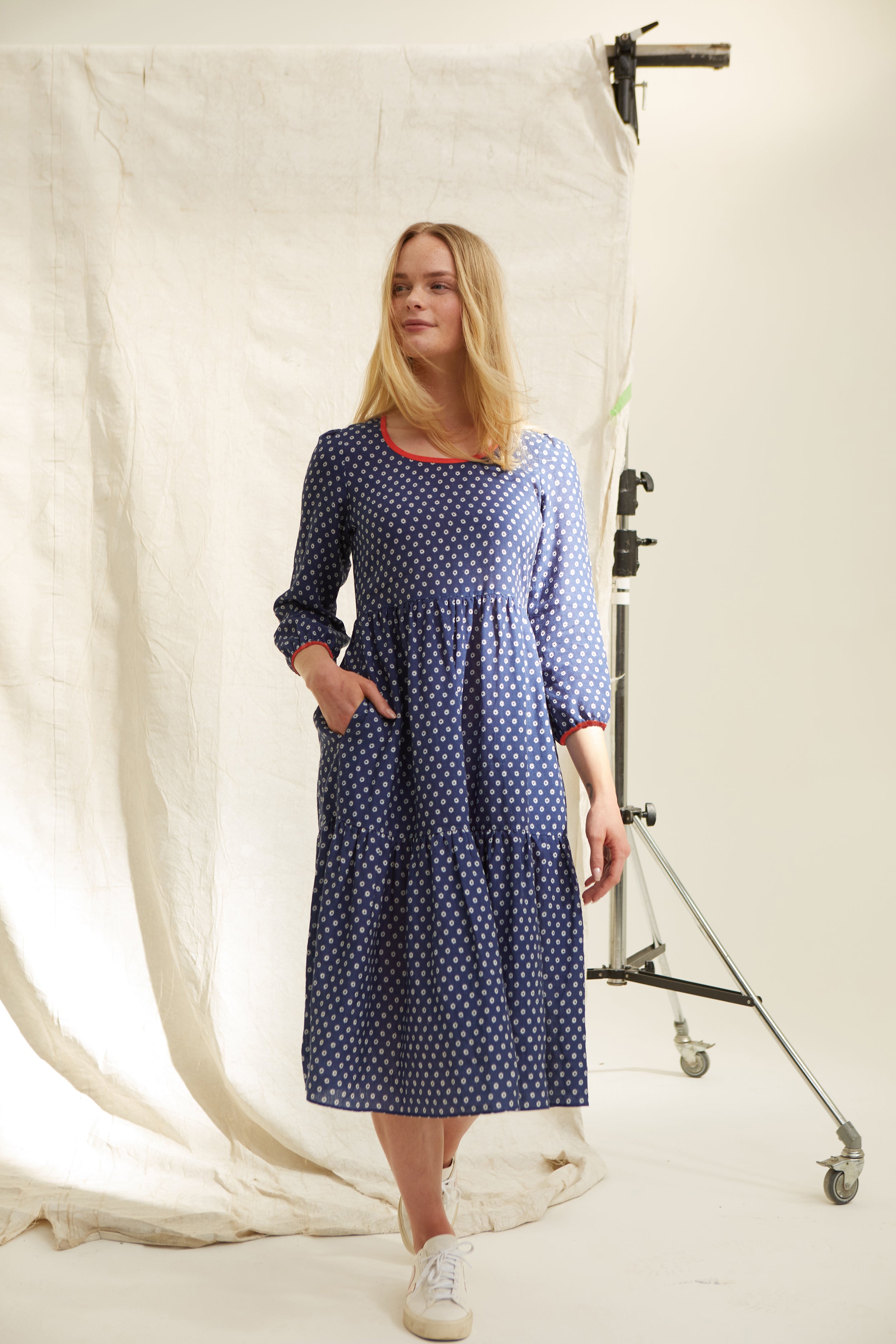 Navy three tier linen dress. Star print.  Easy fit. Over the head. Scoop neckline.  Side slip pockets. Long sleeve. Low mid calf length. 100% linen
